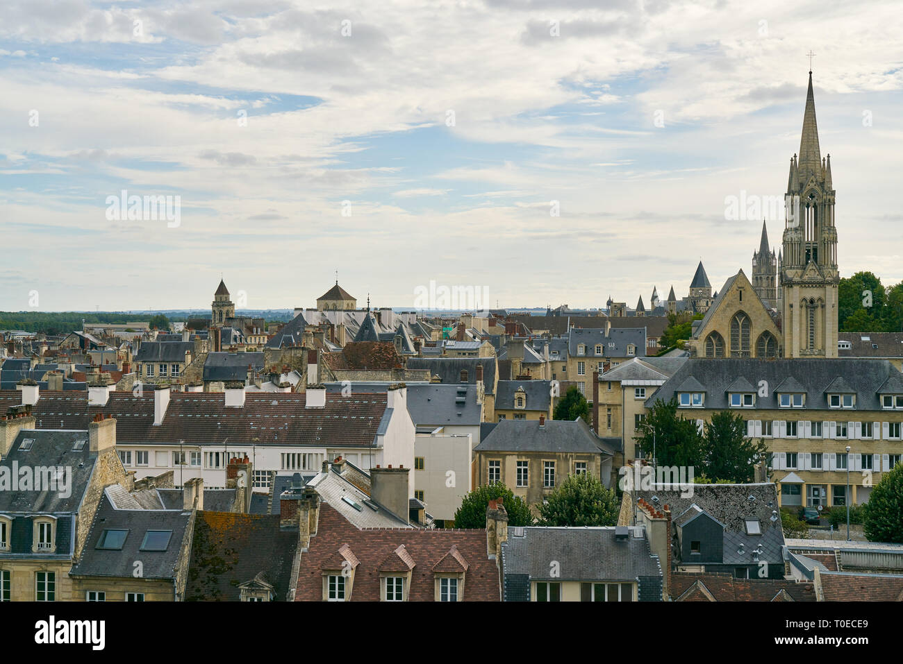 City skyline Caen in France with view over rooftops and church towers Stock Photo