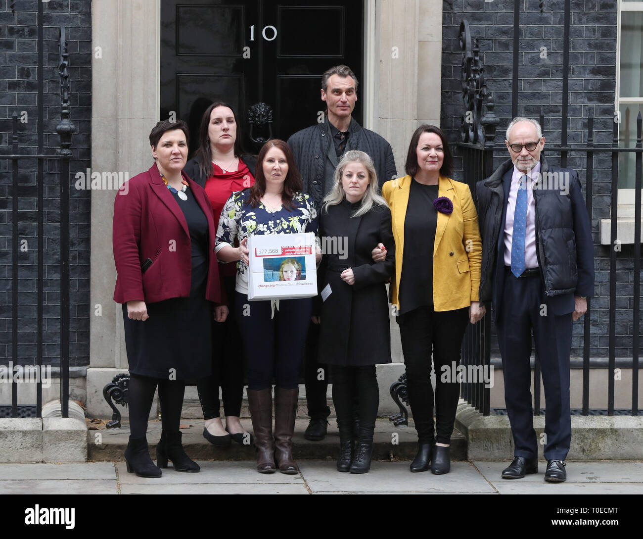 Medical cannabis campaigners (left to right) Toni Antoniazzi, Emma Appleby, Joanne Griffiths, Benedict Lamb, Ashley West, Julie Young and Crispin Blunt, hand a petition in at 10 Downing Street, London. Stock Photo