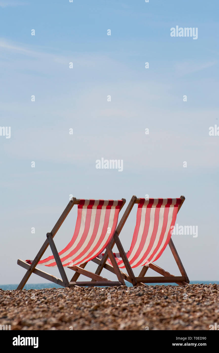 Two deck chairs on brighton beach hi-res stock photography and images ...