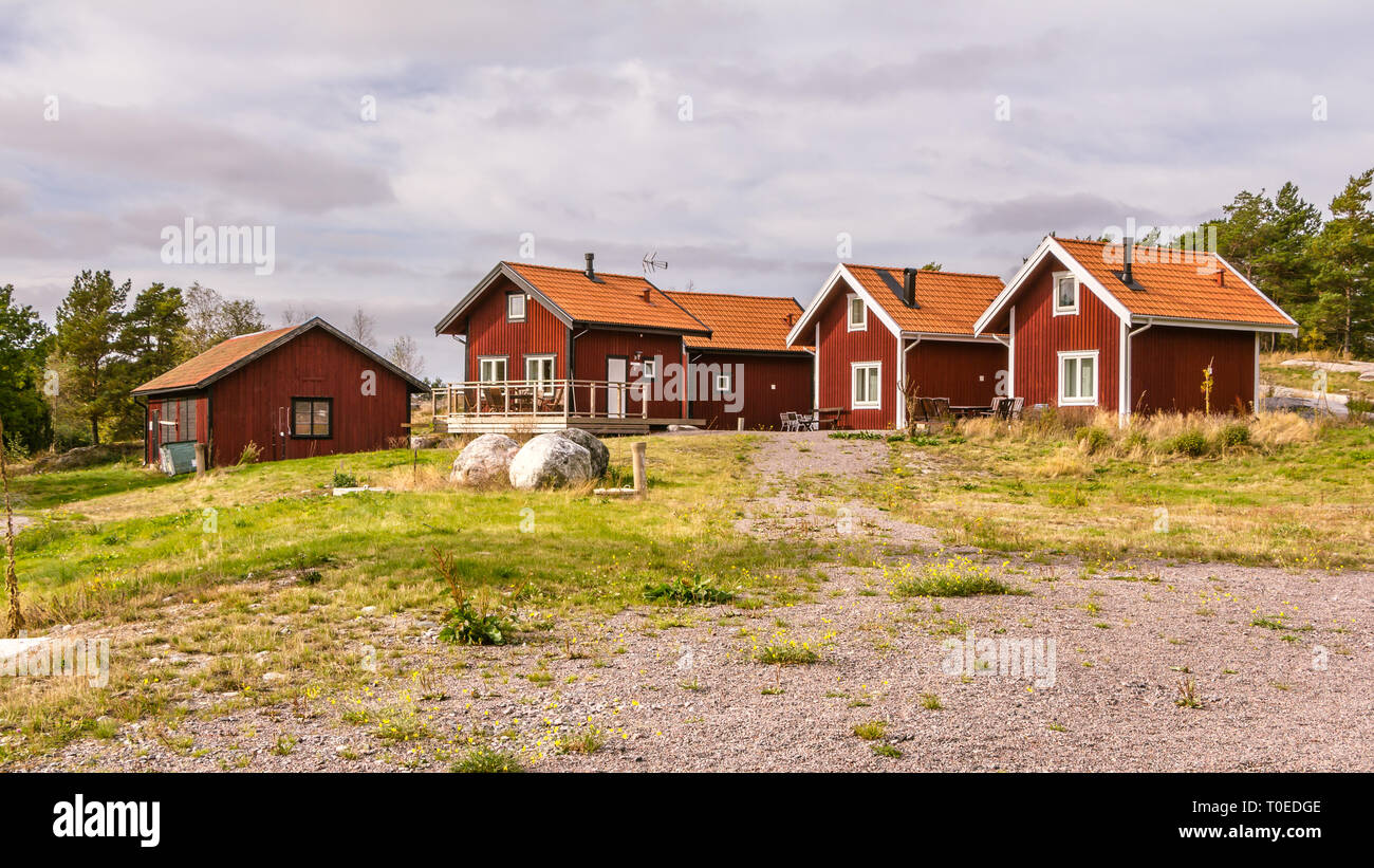 Traditional Red Wooden Holiday Homes In Sweden Europe Stock Photo