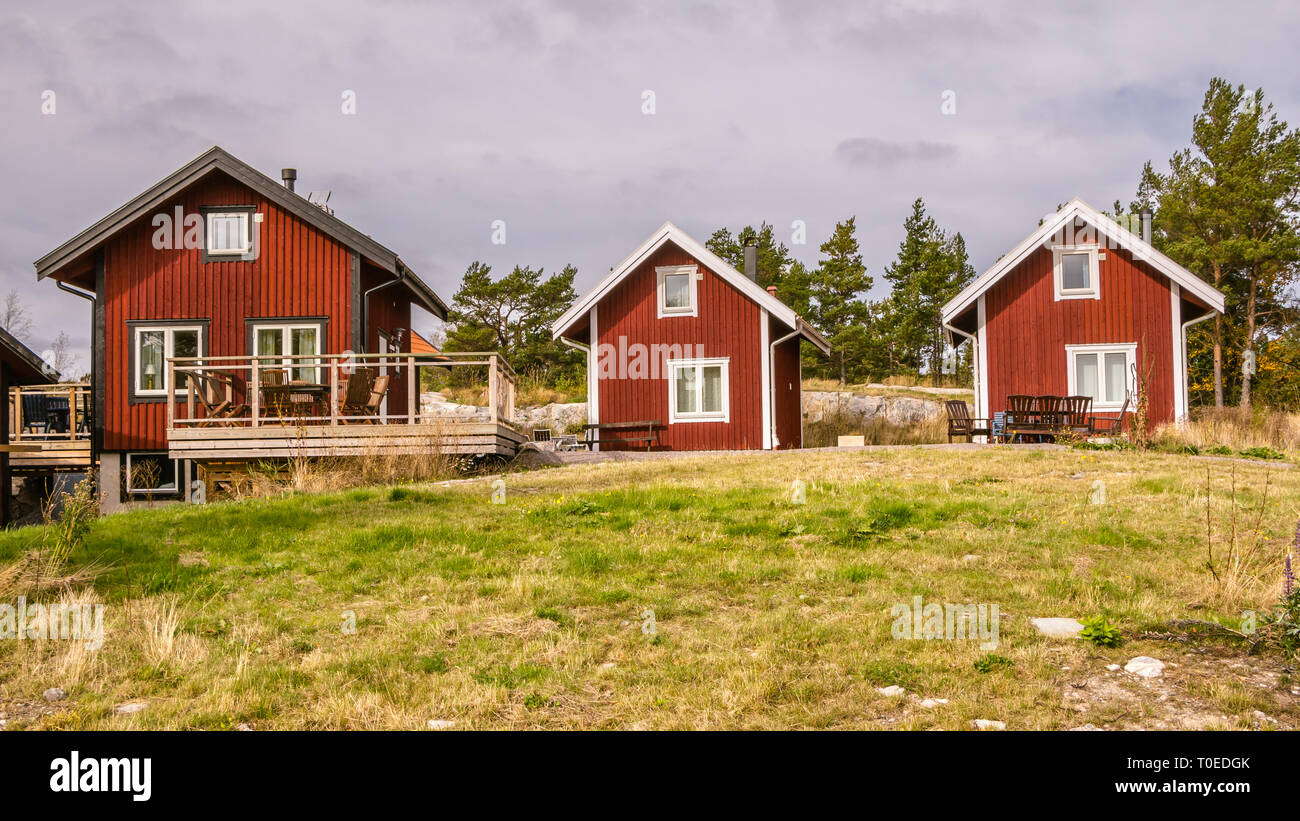 Traditional Red Wooden Holiday Homes In Sweden Europe Stock Photo