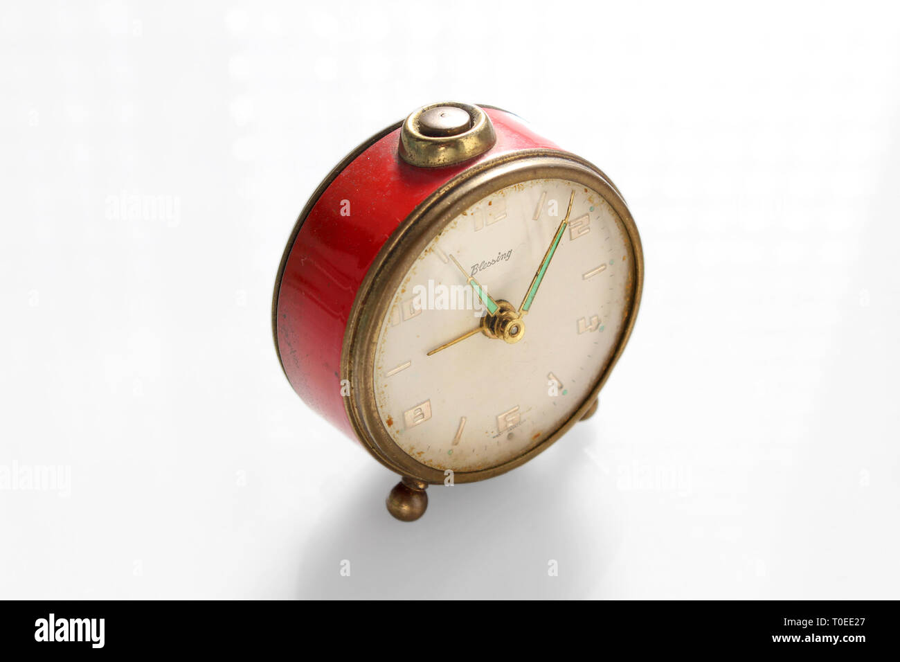 Vintage alarm clock, isolated on white background, close-up Stock Photo