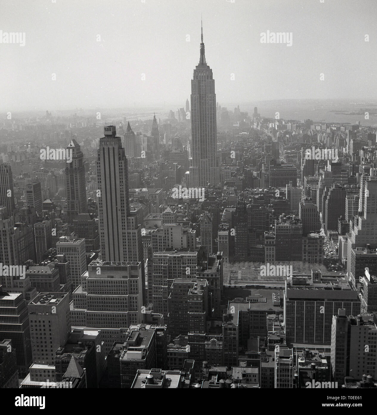 1950s. New York, USA, aerial view over Manhattan and New York city showing skyscrapers and other buildings. Stock Photo