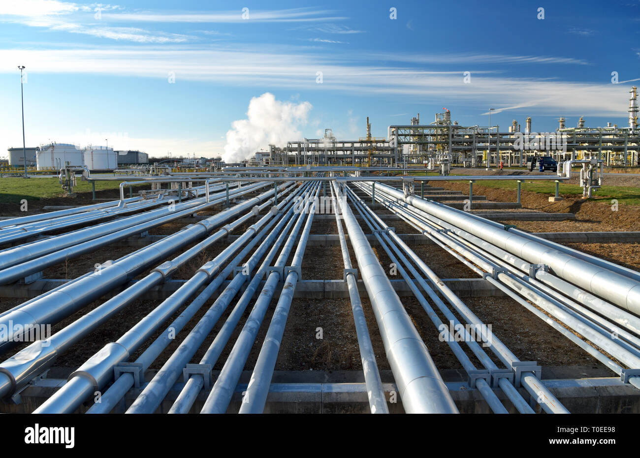 pipelines and buildings of a refinery - industrial plant for fuel production Stock Photo