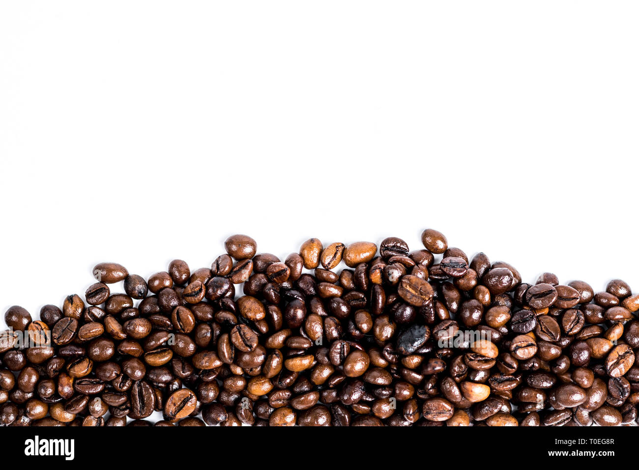 Roasted coffee bean isolated on down white background with copy space ...