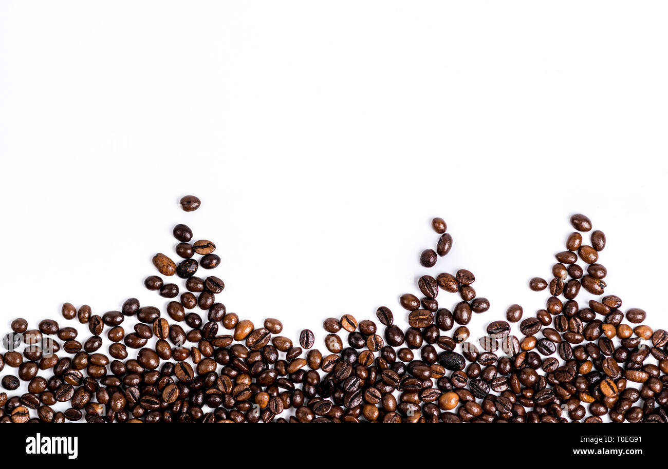 Roasted coffee bean isolated on down white background with copy space ...