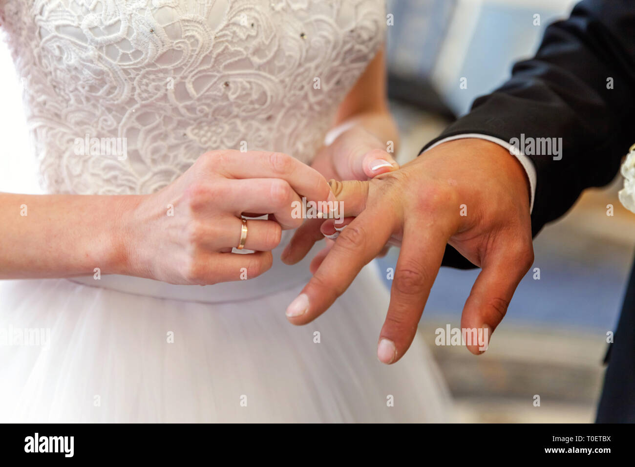 Bride And Groom Marriage Hands With Wedding Rings Bride Hand Putting Wedding Ring On Groom Finger Declaration Of Love Spring Wedding Card Greeting Stock Photo Alamy