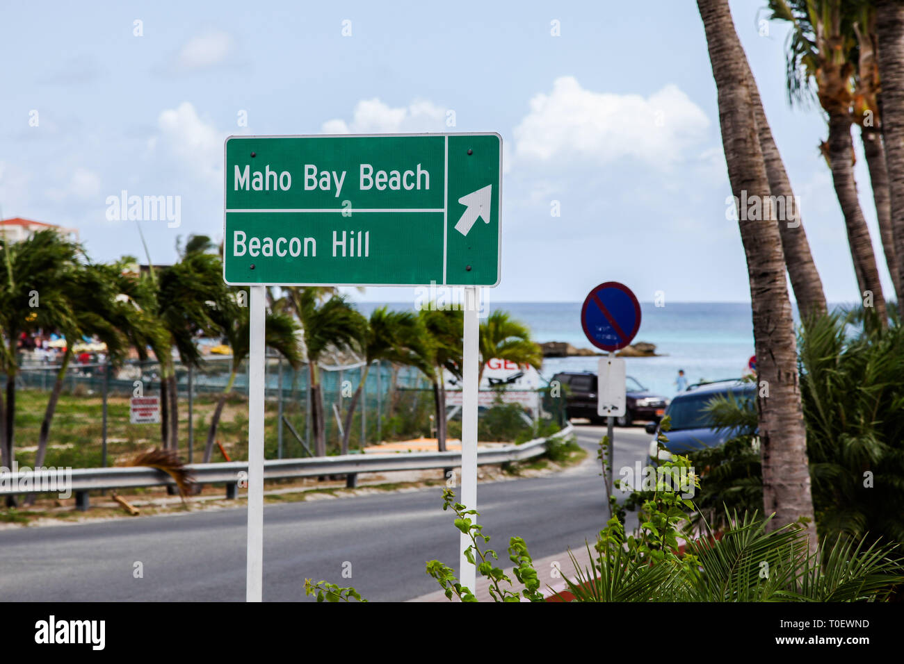 MAHO BAY BEACH, ST.MARTIN-AUGUST 01, 2015:  Maho Bay Beach and Beacon Hill sign near Princess Juliana International Airport. Stock Photo