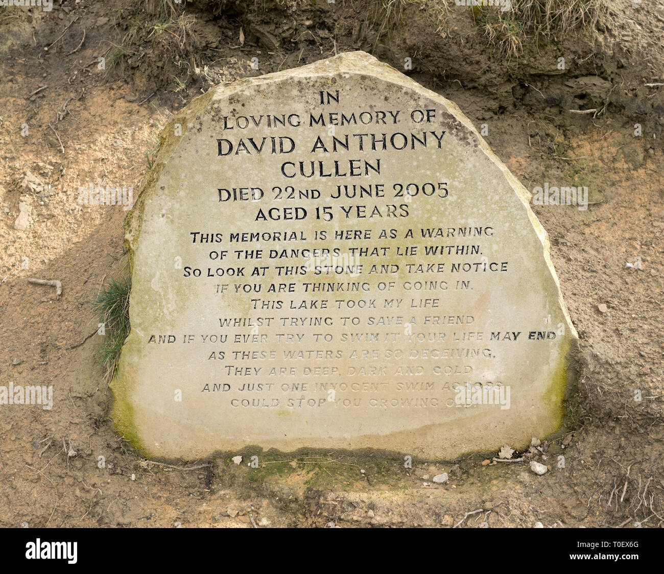 Memorial stone warning of the danger of swimming in the lake, Roundhay Park, Leeds, West Yorkshire, England, UK Stock Photo