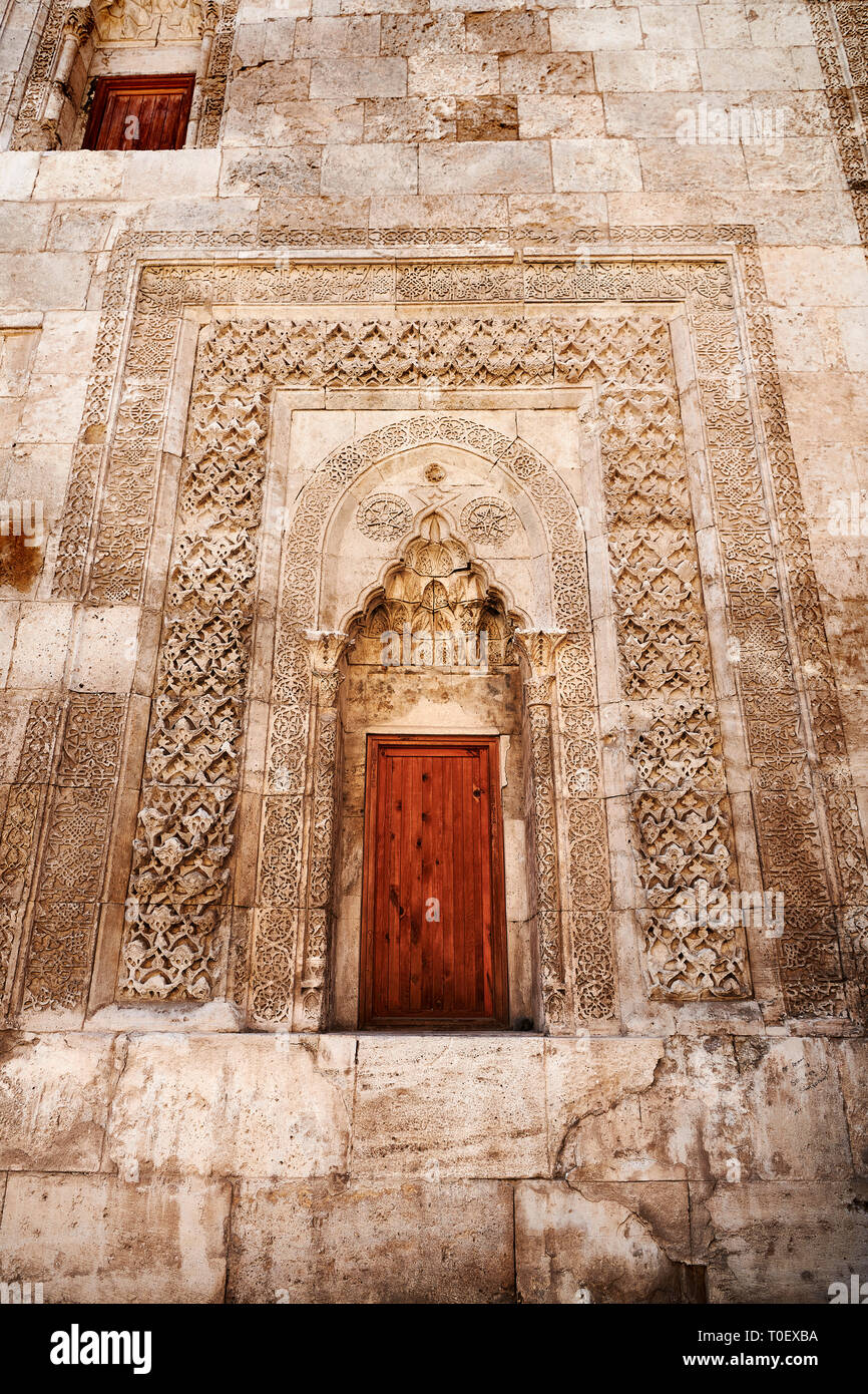 Door of Gök Medrese which has a very rich decorative appearance. Its islamic Muqarnas corbelled vault is made up of a large number of miniature squinc Stock Photo