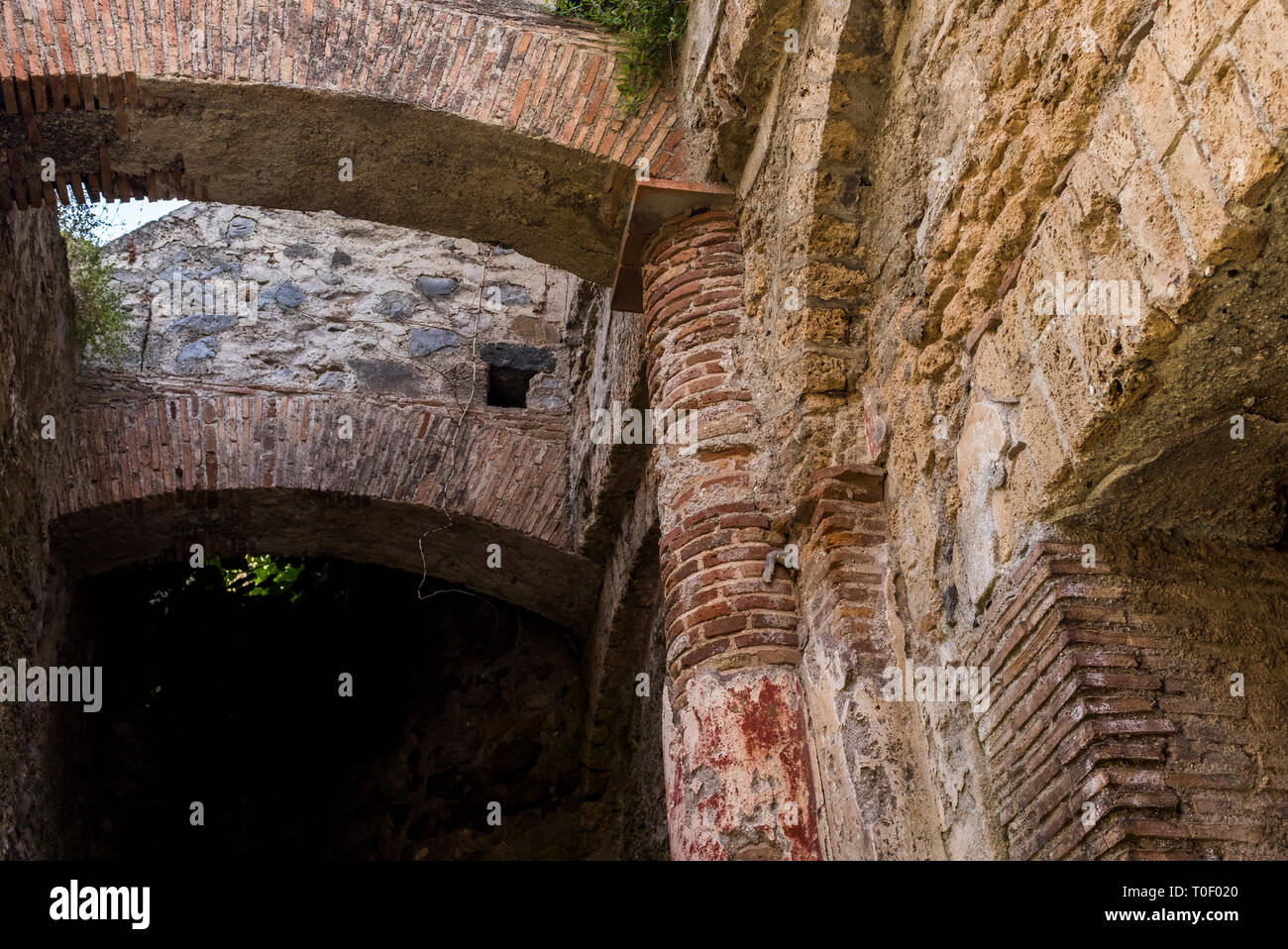 Red paint still visible in the ruins of Villa Romana, an ancient Roman archaeological site hidden in the village of Minori, Italy on the Amalfi Coast Stock Photo