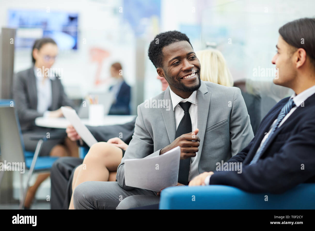 Two Office Workers Talking Stock Photo