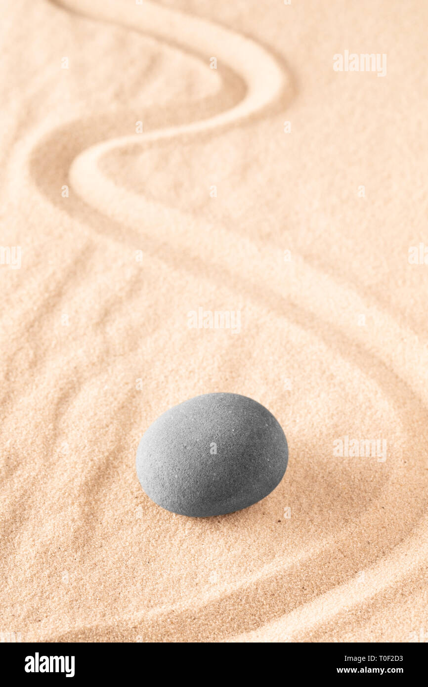 Raked sand and spa wellness healing stones. Zen buddhism meditation