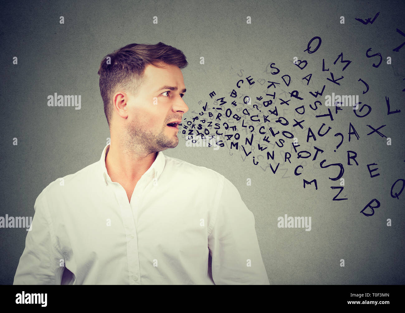 Man talking with alphabet letters coming out of his mouth. Communication, information, concept Stock Photo