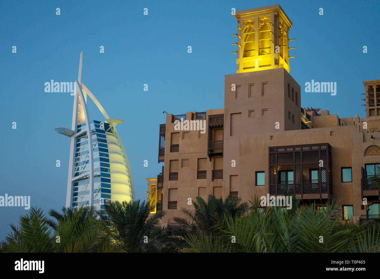Dubai,UAE / 11. 03. 2018 : burj al arab in souk madinat jumeirah background with arabic architecture bastion Stock Photo
