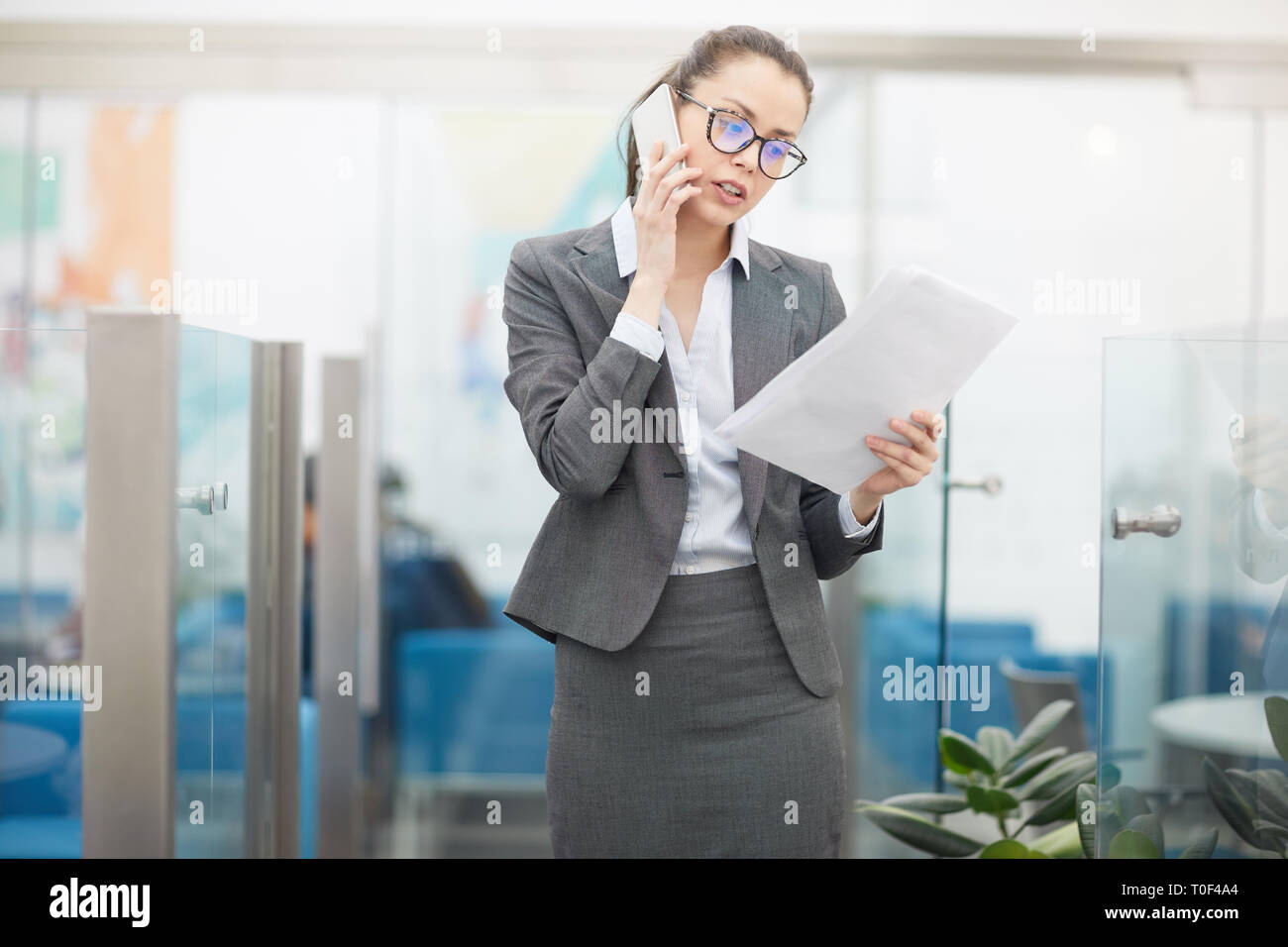 Female Boss in Speaking by Phone Stock Photo