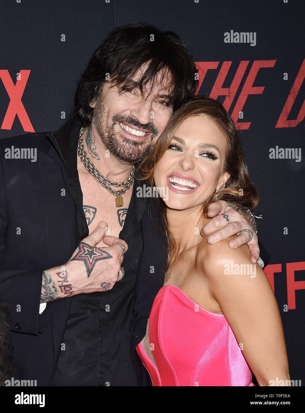HOLLYWOOD, CA - MARCH 18: Tommy Lee (L) and Rebekah Graf arrive at the