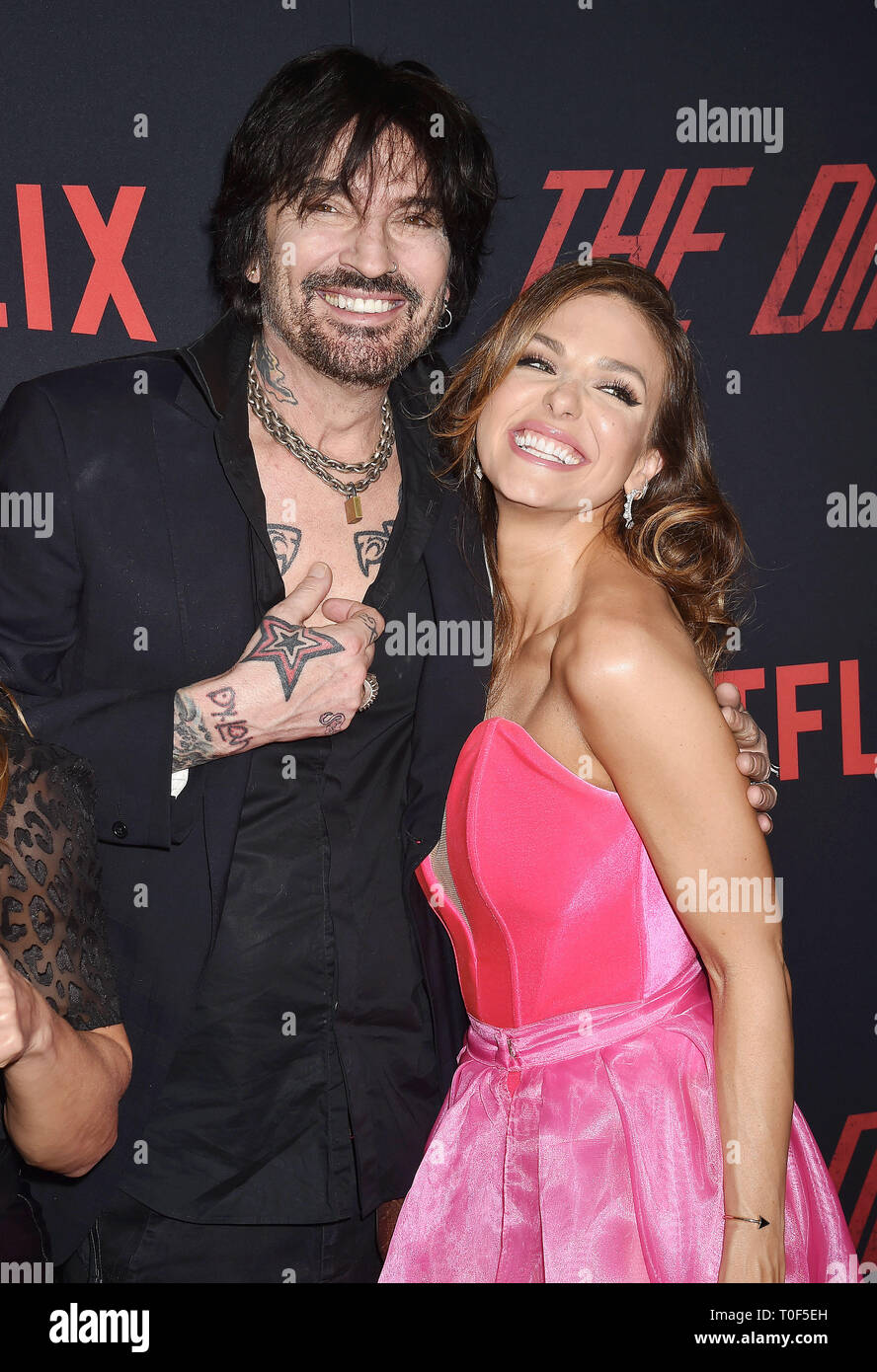 HOLLYWOOD, CA - MARCH 18: Tommy Lee (L) and Rebekah Graf arrive at the