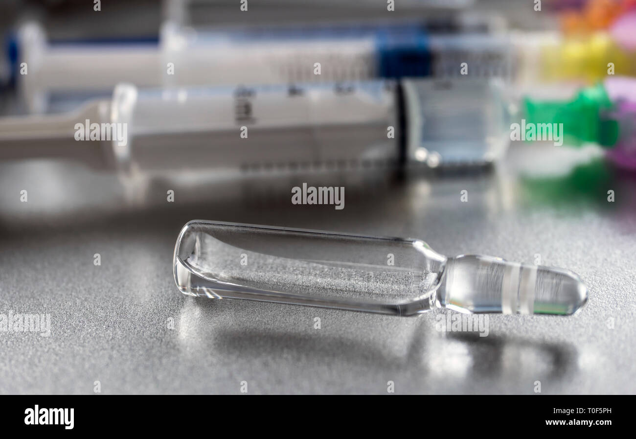 Medicine in vials and syringe ready for vaccine injection Stock Photo