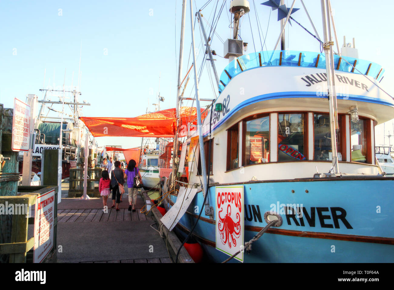 RICHMOND, CANADA - JUL 24, 2010: Fishing trawlers moored at the picturesque seaside village of Steveston's Fisherman's Wharf selling the day's catch a Stock Photo