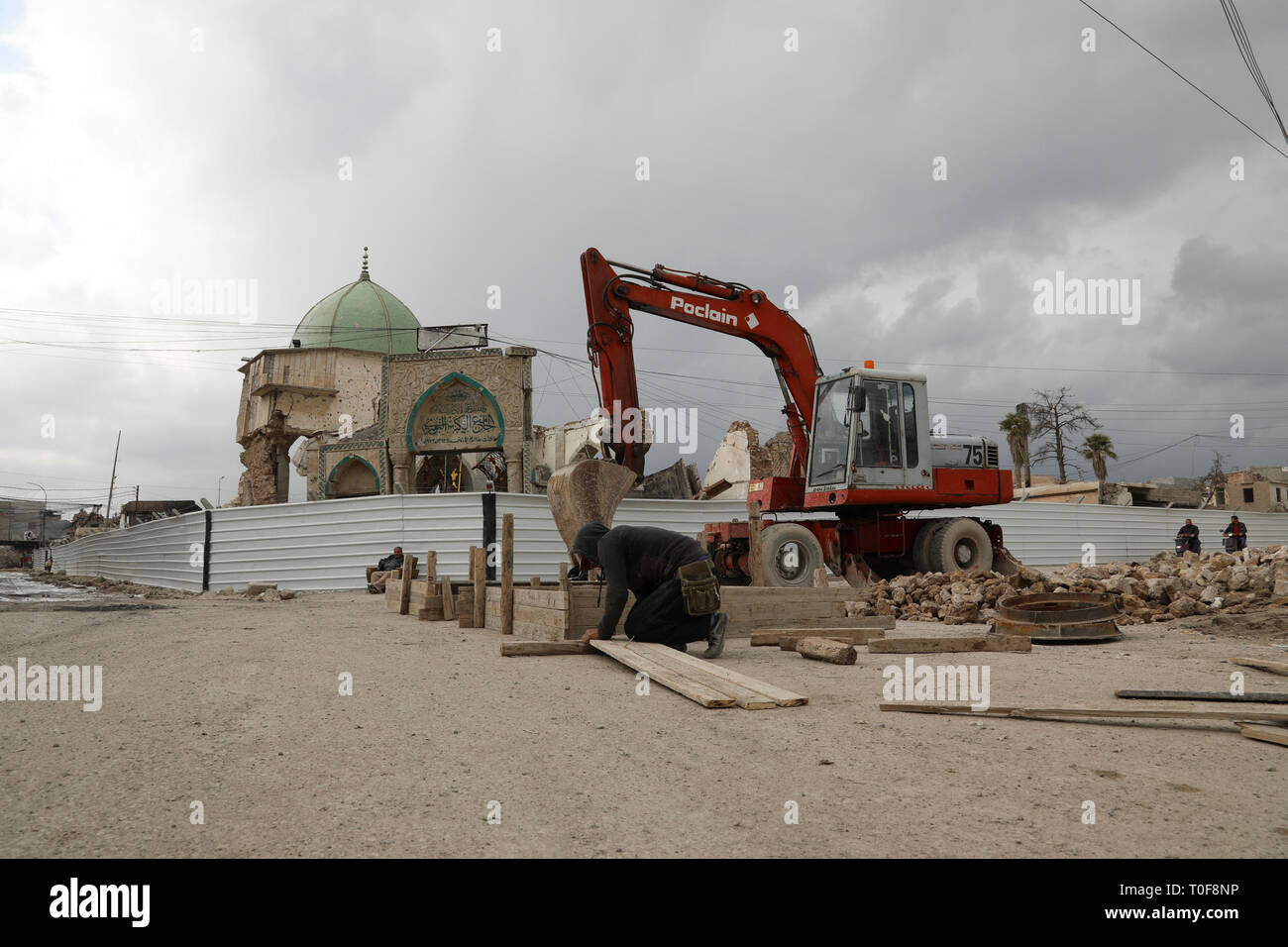 Baghdad, Iraq. 19th Mar, 2019. A laborer works in front of the destroyed al-Nuri mosque in the old city of Mosul, Iraq, March 7, 2019. (TO GO WITH Feature: Rising hopes, opportunities 16 years after U.S.-led invasion in Iraq, released on March 19, 2019) Credit: Xinhua/Alamy Live News Stock Photo