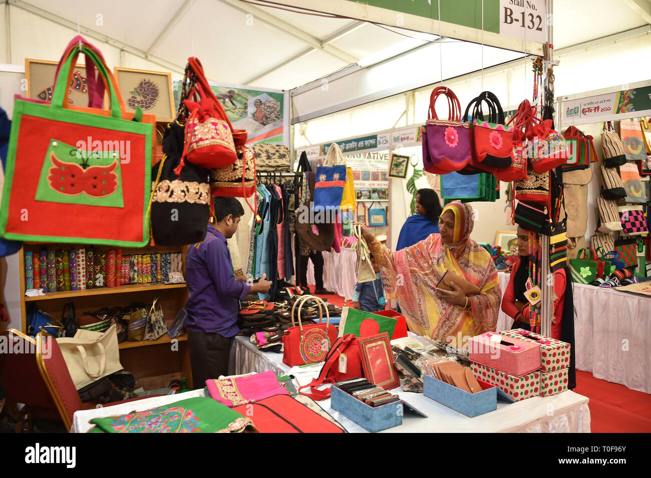 Dhaka, Bangladesh. 19th Mar, 2019. A visitor chooses jute products at a stall during Bangladesh's National Small and Medium Enterprise (SME) Fair-2019 in Dhaka, capital of Bangladesh, March 19, 2019. The fair aimed at promoting the SME products and introduction of SME goods for expanding business, trade and commerce. The fair will open until March 22. Credit: Stringer/Xinhua/Alamy Live News Stock Photo