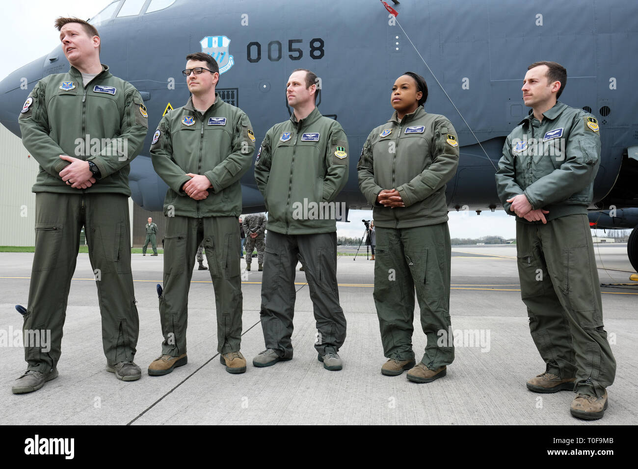 RAF Fairford, Gloucestershire, UK. 19th March 2019. Flight crew from the USAF 2nd Bomb Wing stand in front of a B-52H Stratofortress bomber as RAF Fairford welcomes a Bomber Task Force deployment of six Boeing B-52H Stratofortress aircraft to RAF Fairford from the 2nd Bomb Wing in Louisiana, USA - the largest deployment of B-52s to the UK since Operation Iraqi Freedom in 2003. The aircraft will perform training sorties over The Baltic, Central Europe and the Eastern Mediterranean. Credit: Steven May/Alamy Live News Stock Photo