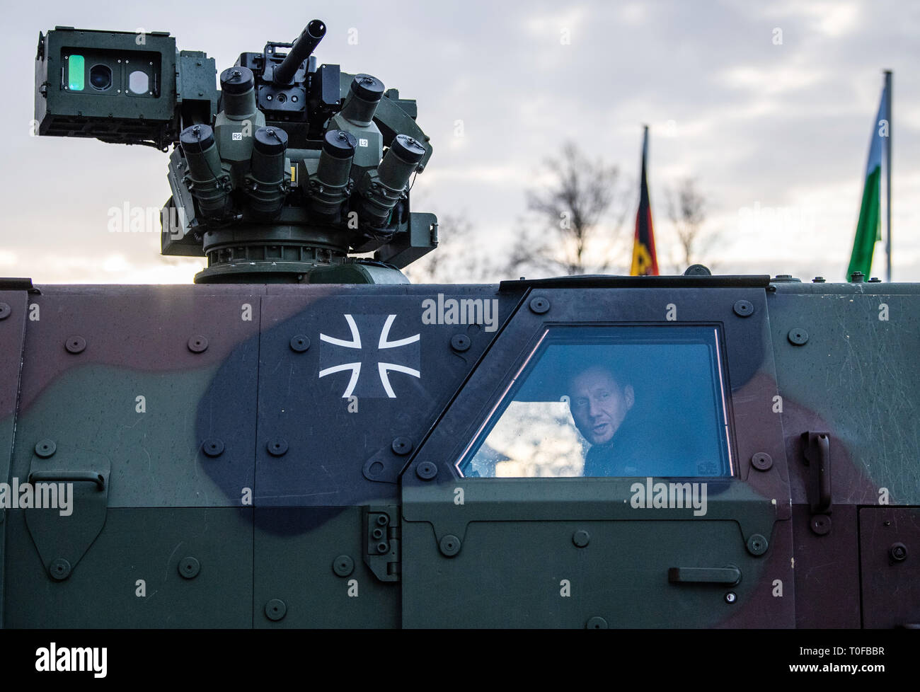 Frankenberg, Germany. 19th Mar, 2019. Michael Kretschmer (CDU), Prime Minister of Saxony, sits during a visit of the Panzergrenadierbrigade 37 in a transport vehicle Dingo and looks out of the window. Kretschmer visited the unit to find out about its performance and to talk to soldiers. Credit: Robert Michael/dpa-Zentralbild/dpa/Alamy Live News Stock Photo