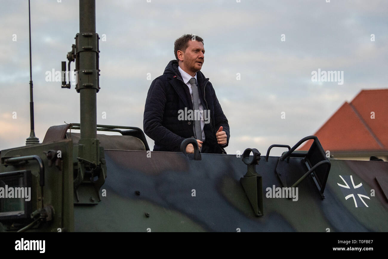 Frankenberg, Germany. 19th Mar, 2019. Michael Kretschmer (CDU), Prime Minister of Saxony, looks out of a Bundeswehr armoured transport vehicle Fuchs during a visit to Panzergrenadierbrigade 37. Kretschmer visited the unit to find out about its performance and to talk to soldiers. Credit: Robert Michael/dpa-Zentralbild/dpa/Alamy Live News Stock Photo