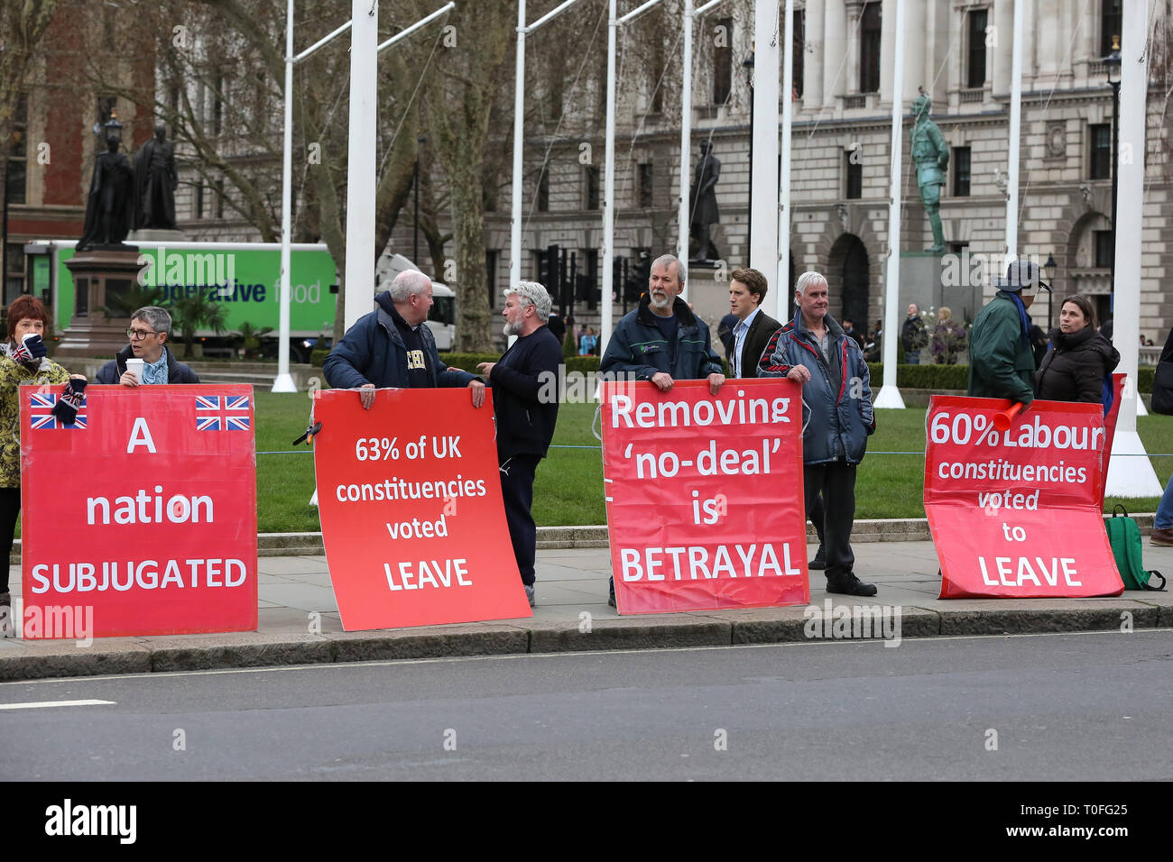 Pro-Brexit demonstrators with placards are seen protesting outside the Houses of Parliament.  The UK will leave the EU on 29 March 2019. Stock Photo