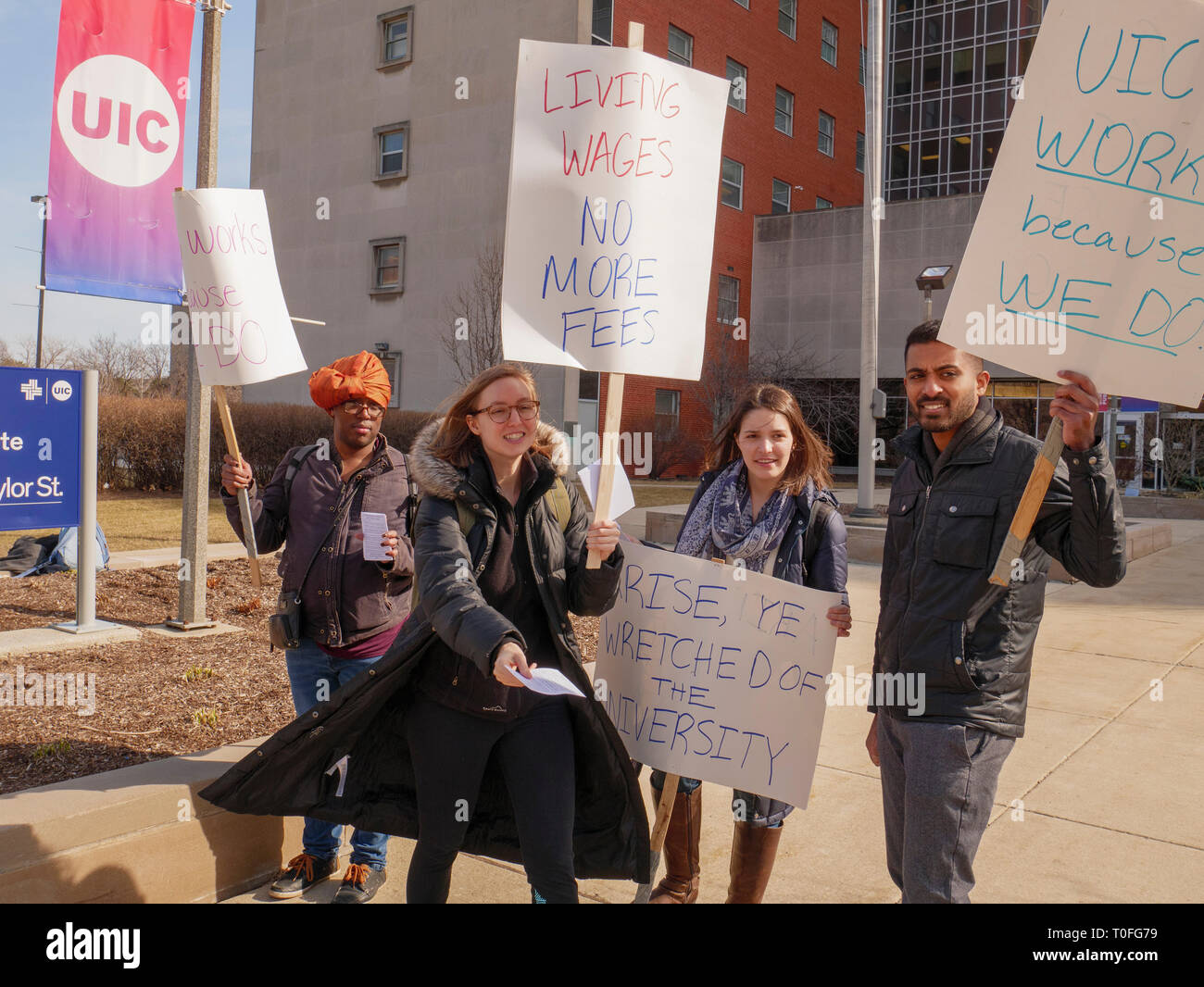 Chicago, Illinois, USA. 19th March 2019.  Graduate Assistants picket in from of the University of Illinois at Chicago's School of Public Health. The graduate workers are asking for a living wage and not having fees equal to 10% of their income deducted from their pay. Credit: Todd Bannor/Alamy Live News Stock Photo