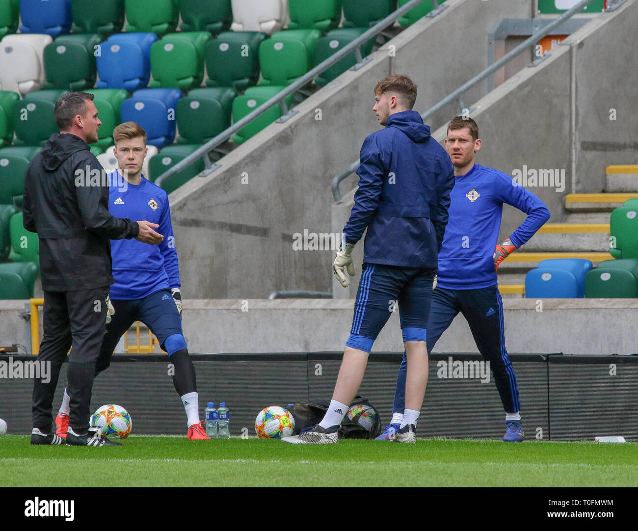 Windsor Park, Belfast, Northern Ireland.20 March 2019. Northern Ireland training in Belfast this morning ahead of their UEFA EURO 2020 Qualifier against Estonia tomorrow night in the stadium. Goalkeeping coach Steve Harper (left) with Bailey Peacock-Farrell, Conor Hazard  and Michael McGovern. Credit: David Hunter/Alamy Live News. Stock Photo