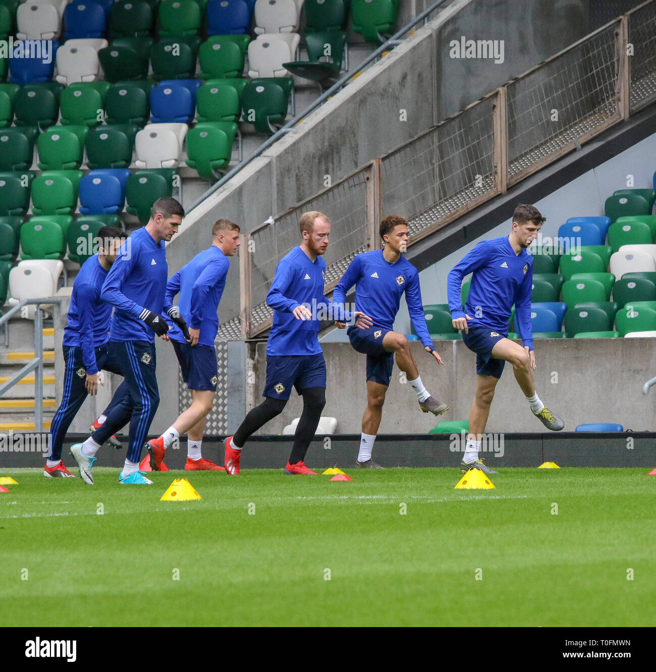 Windsor Park, Belfast, Northern Ireland.20 March 2019. Northern Ireland training in Belfast this morning ahead of their UEFA EURO 2020 Qualifier against Estonia tomorrow night in the stadium.  Craig Cathcart leads this group in training. Credit: David Hunter/Alamy Live News. Stock Photo