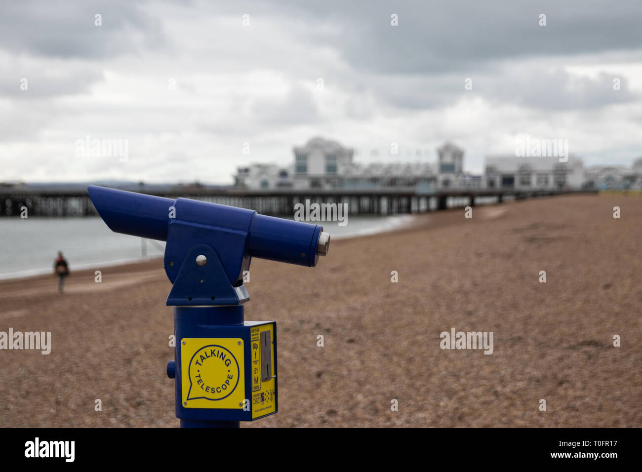 Talking telescope at the beach close up with South parade pier in the background, Southsea, Portsmouth,Hampshire, UK Stock Photo