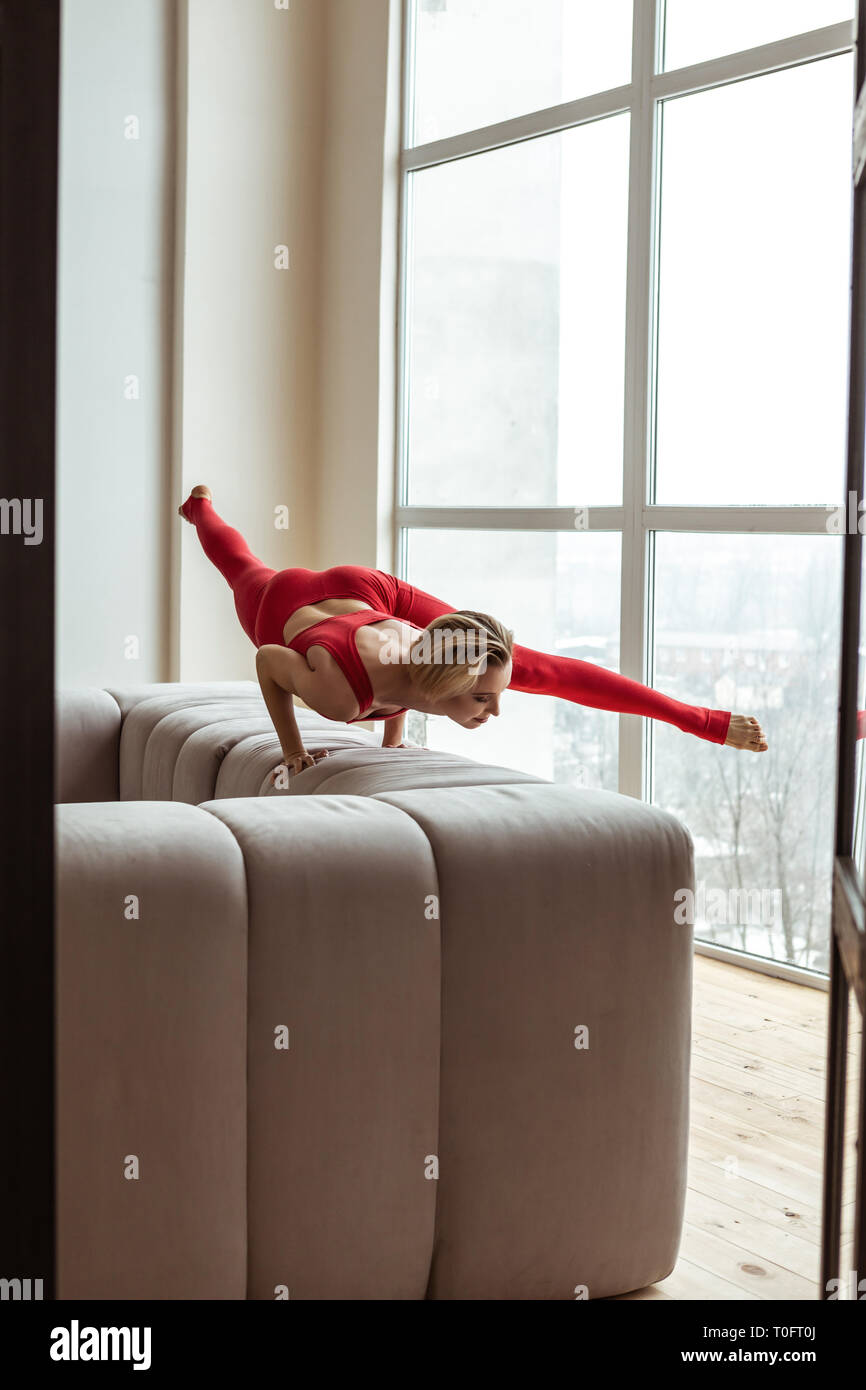 Strong shorthaired lady completing extremely hard exercise Stock Photo Alamy