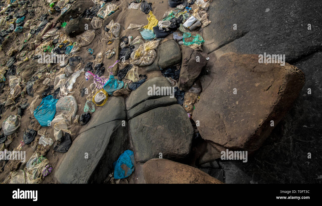 A build up of plastic waste washed up from the South China Sea. Photographed here on the Malaysian coastline of Borneo. Stock Photo