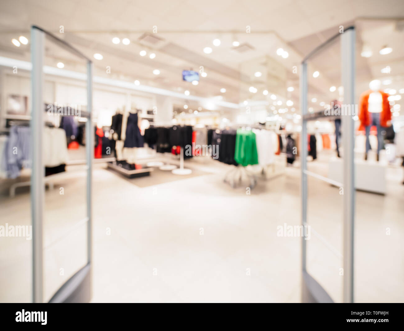 Abstract blurred entrance area of cloth store as background. Clothes shop blur Stock Photo