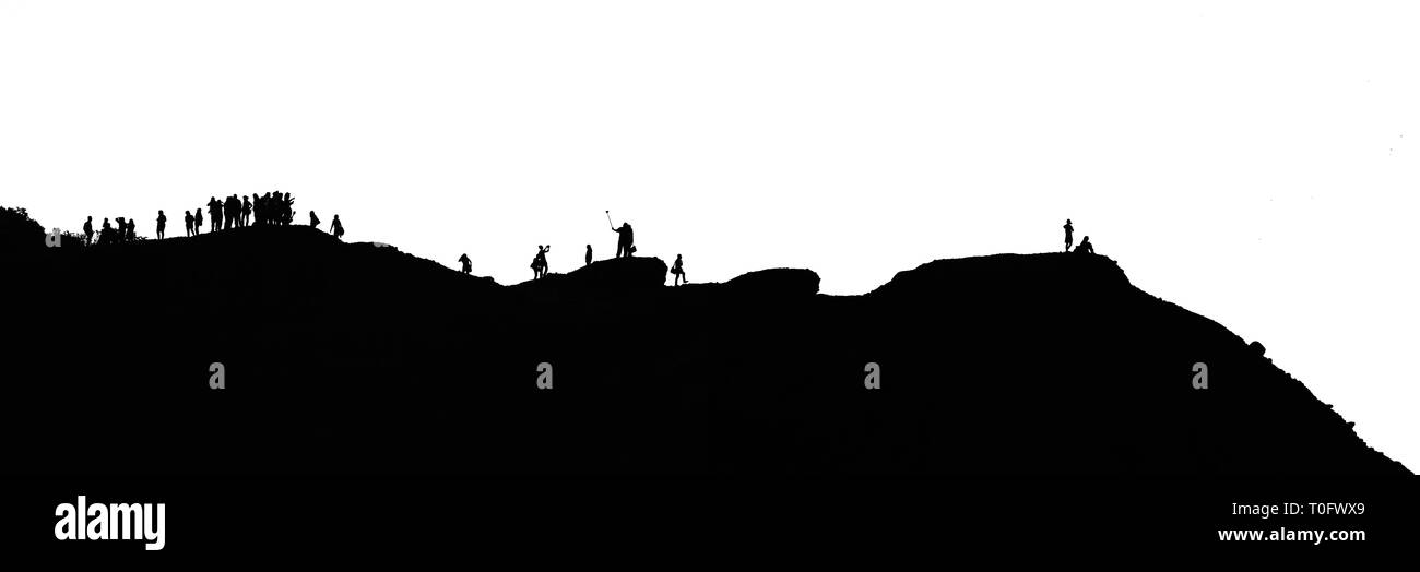 Monochrome picture of people at the hill top, doing various things. Stock Photo