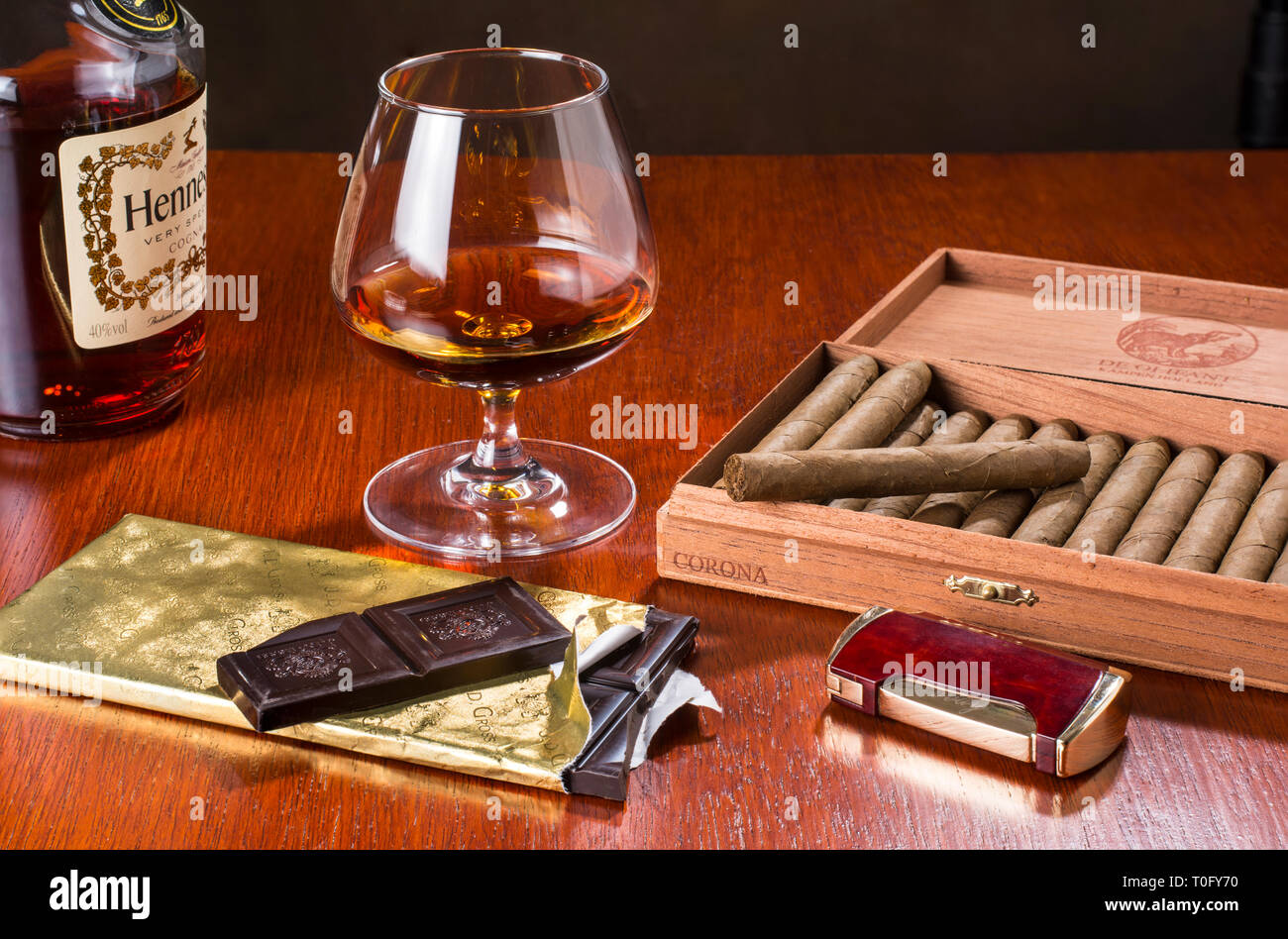 Dark chocolate, whisky and cigars go very well together, especially after dinner Stock Photo