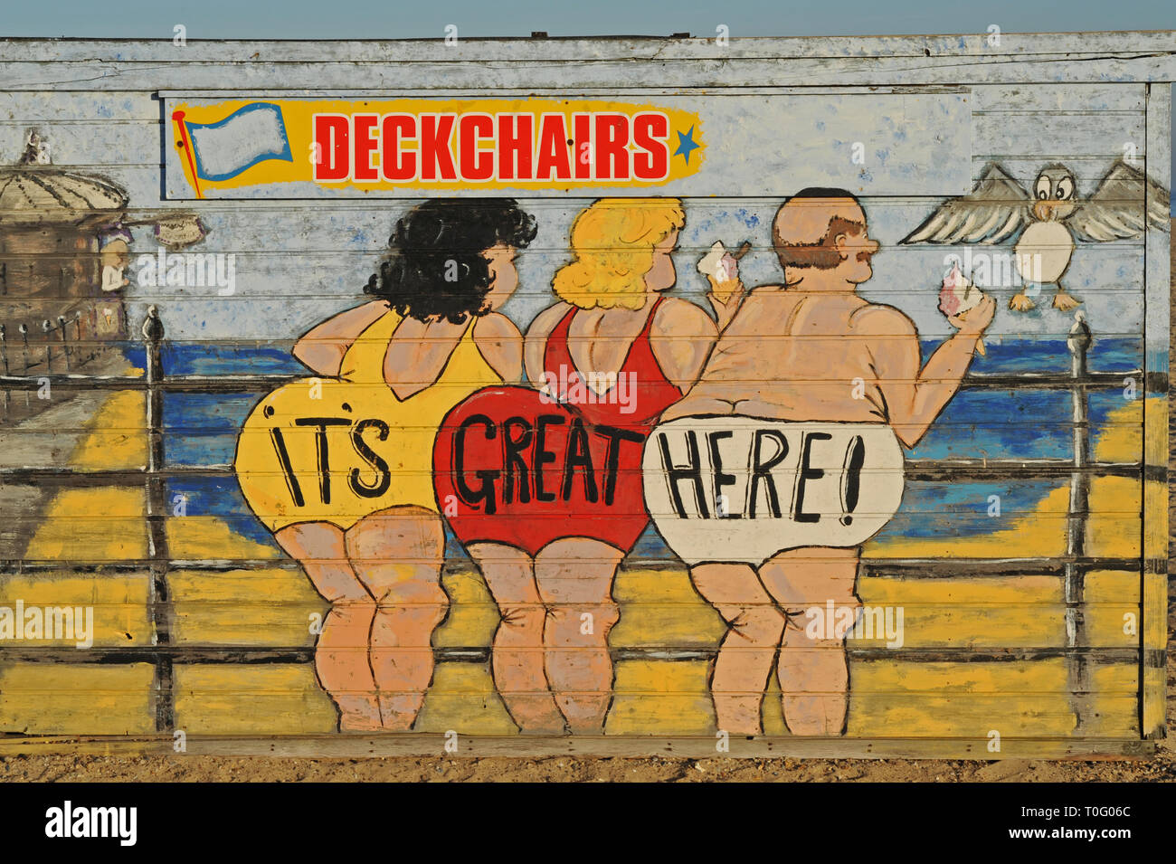 Saucy artwork on a timber building on the beach at Great Yarmouth Stock Photo
