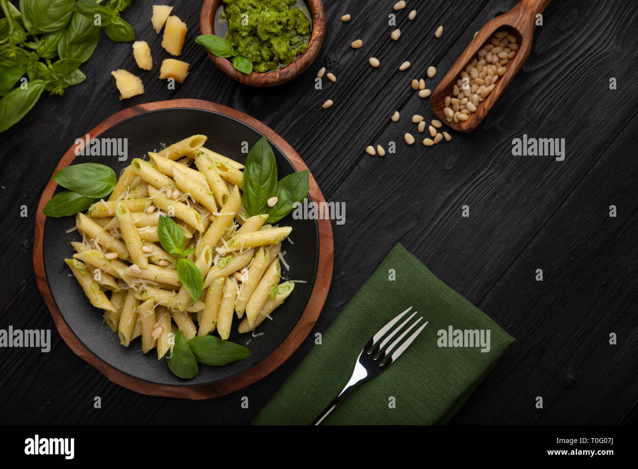 Pasta with pesto on black Stock Photo