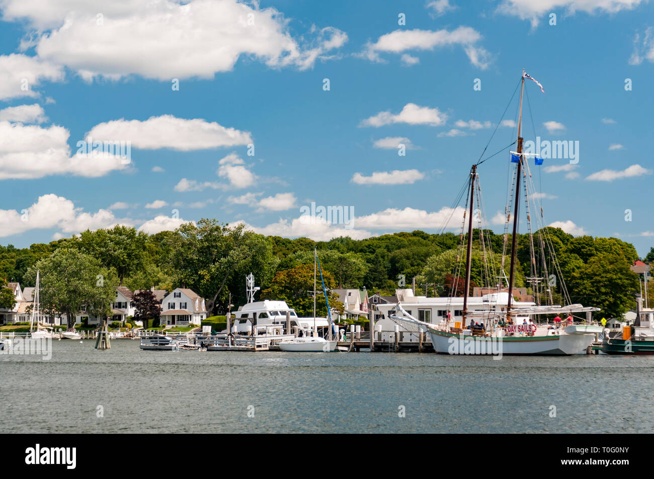 View of the Mystic Seaport with boats and houses, Connecticut Stock