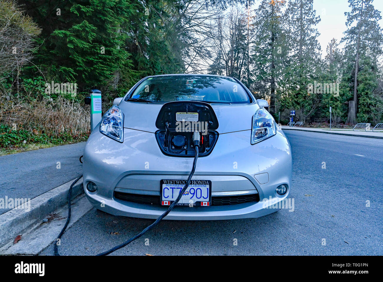 Nissan Leaf, Electric car at charging station, Stanley Park, Vancouver, British Columbia, Canada Stock Photo