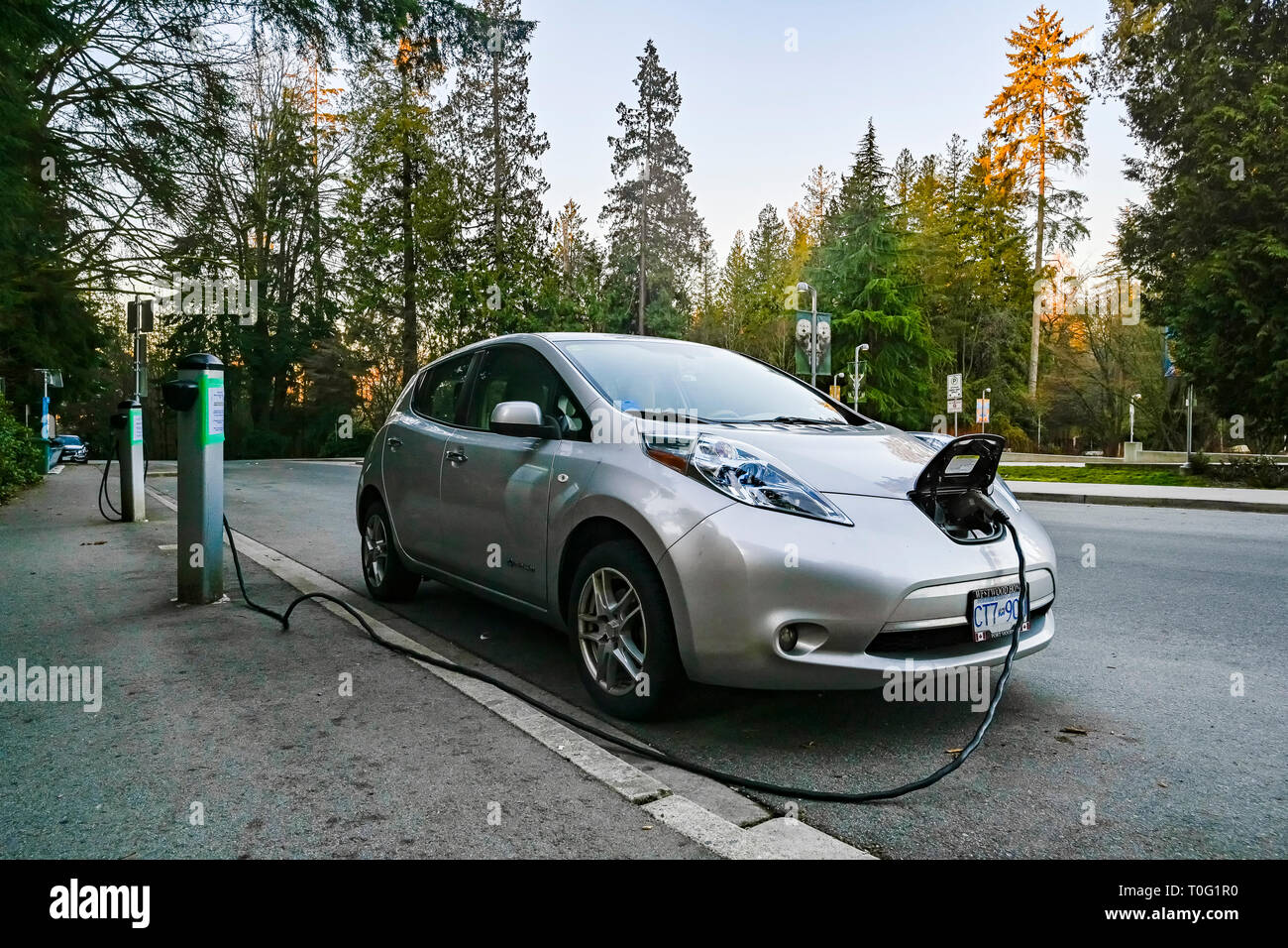 Nissan Leaf, Electric car at charging station, Stanley Park, Vancouver, British Columbia, Canada Stock Photo