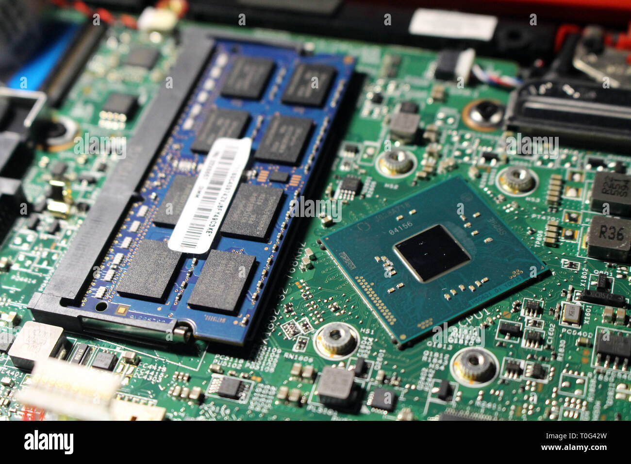 Closeup view at laptop motherboard and components. Processor and memory  look like mini cities Stock Photo - Alamy