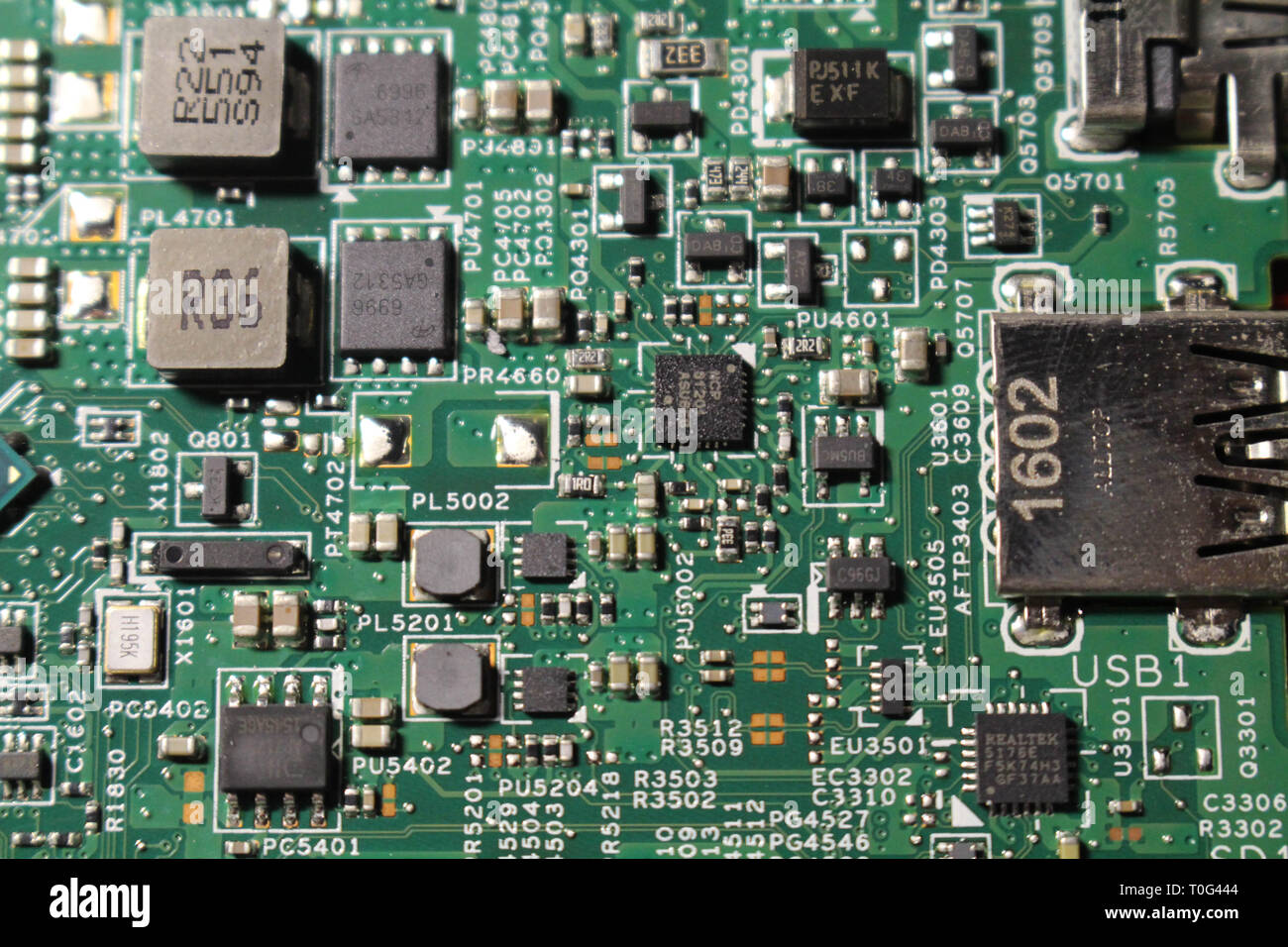 Closeup view at laptop motherboard and semiconductors components. Look ...