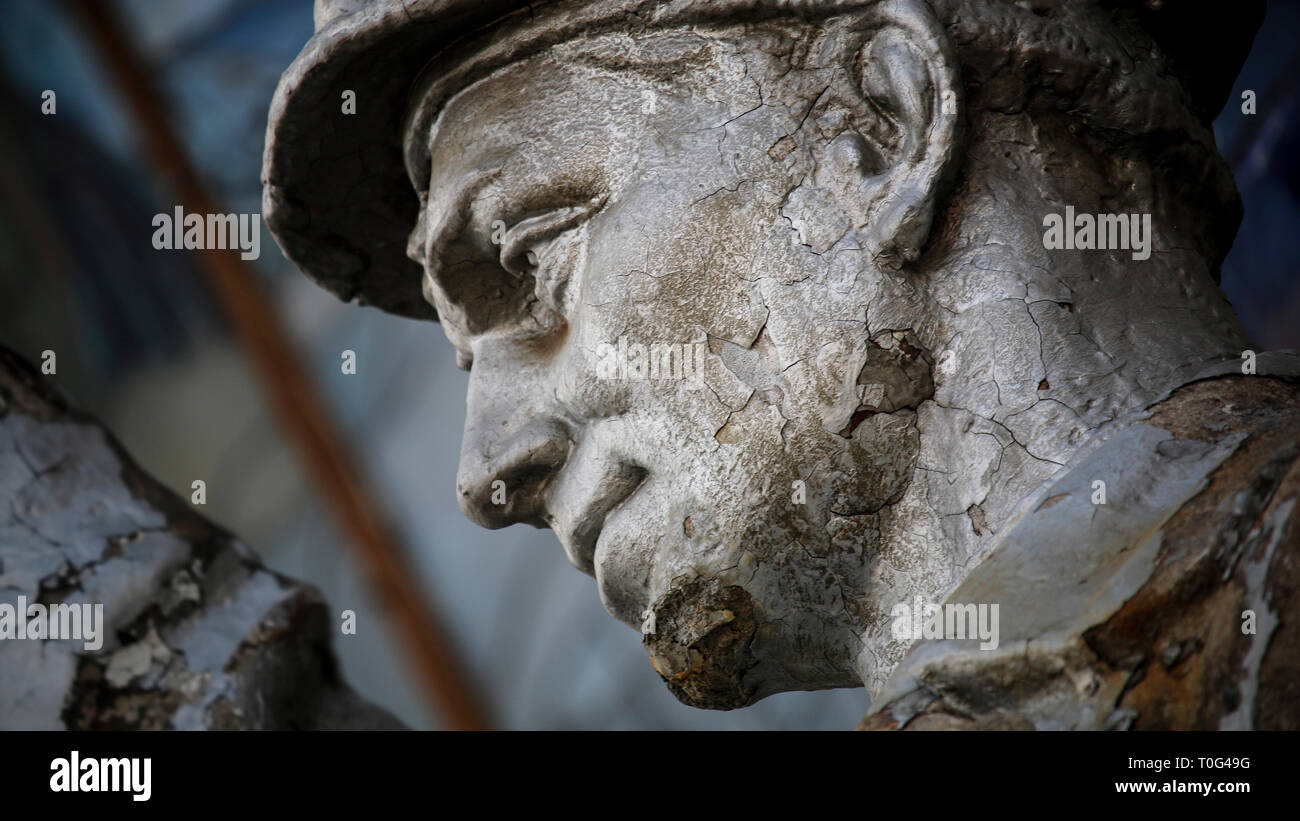Crumbling workers statues at the All-Russian Exhibition Centre in Moscow. Stock Photo