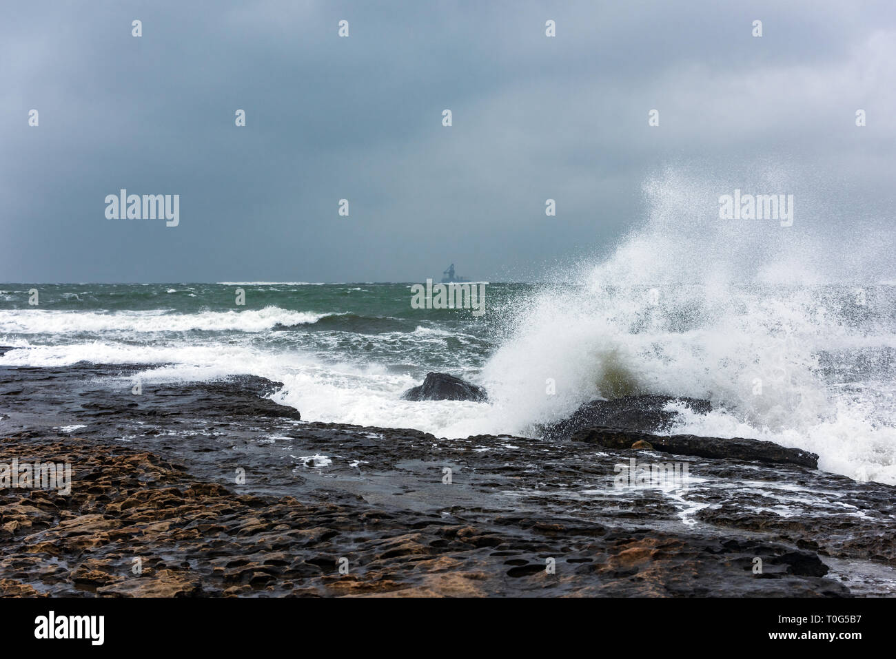 Splash of big waves on a rocky seashore landscape Stock Photo - Alamy