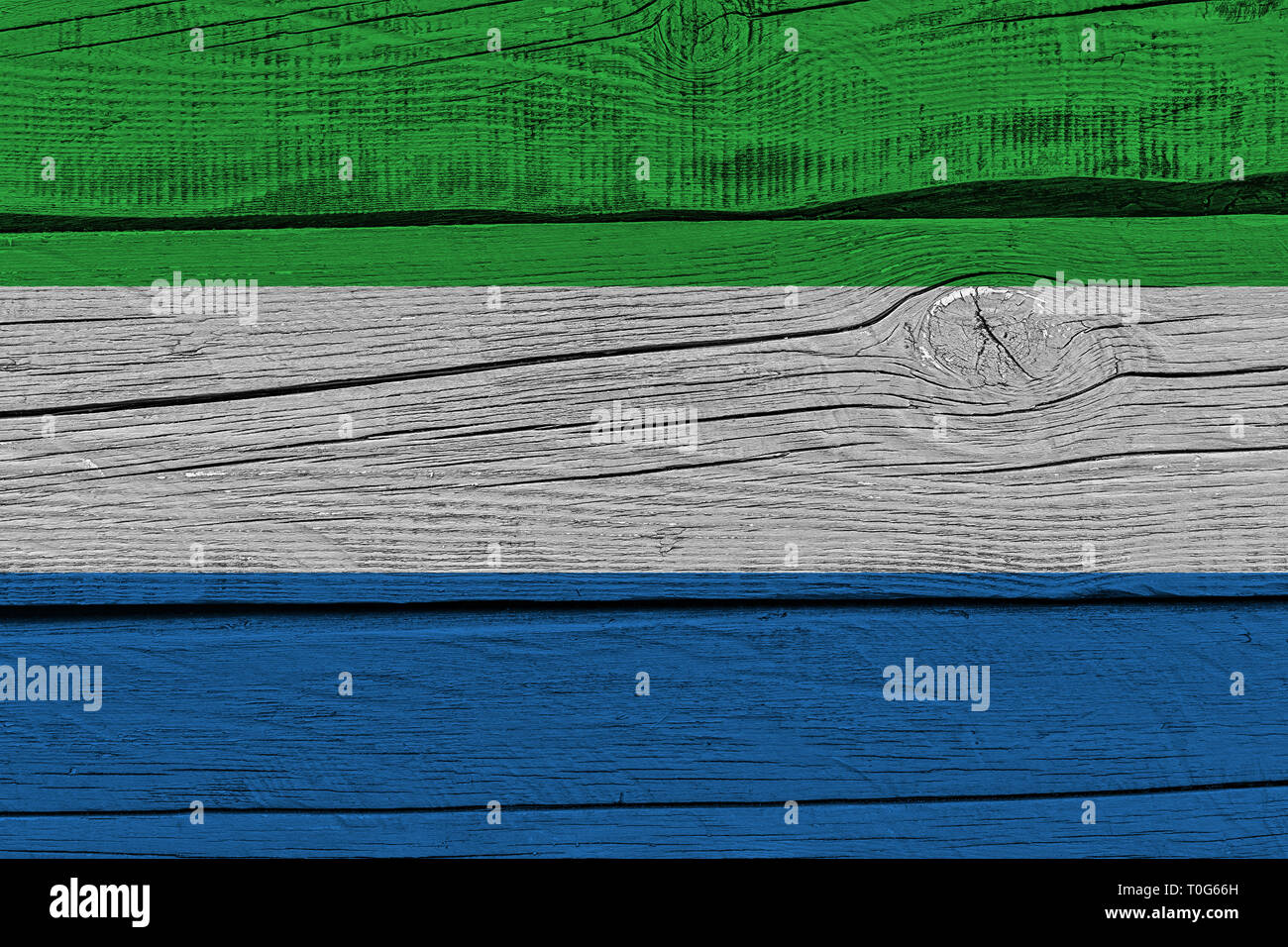 Sierra leone flag painted on old wood plank. Patriotic background. National flag of Sierra leone Stock Photo