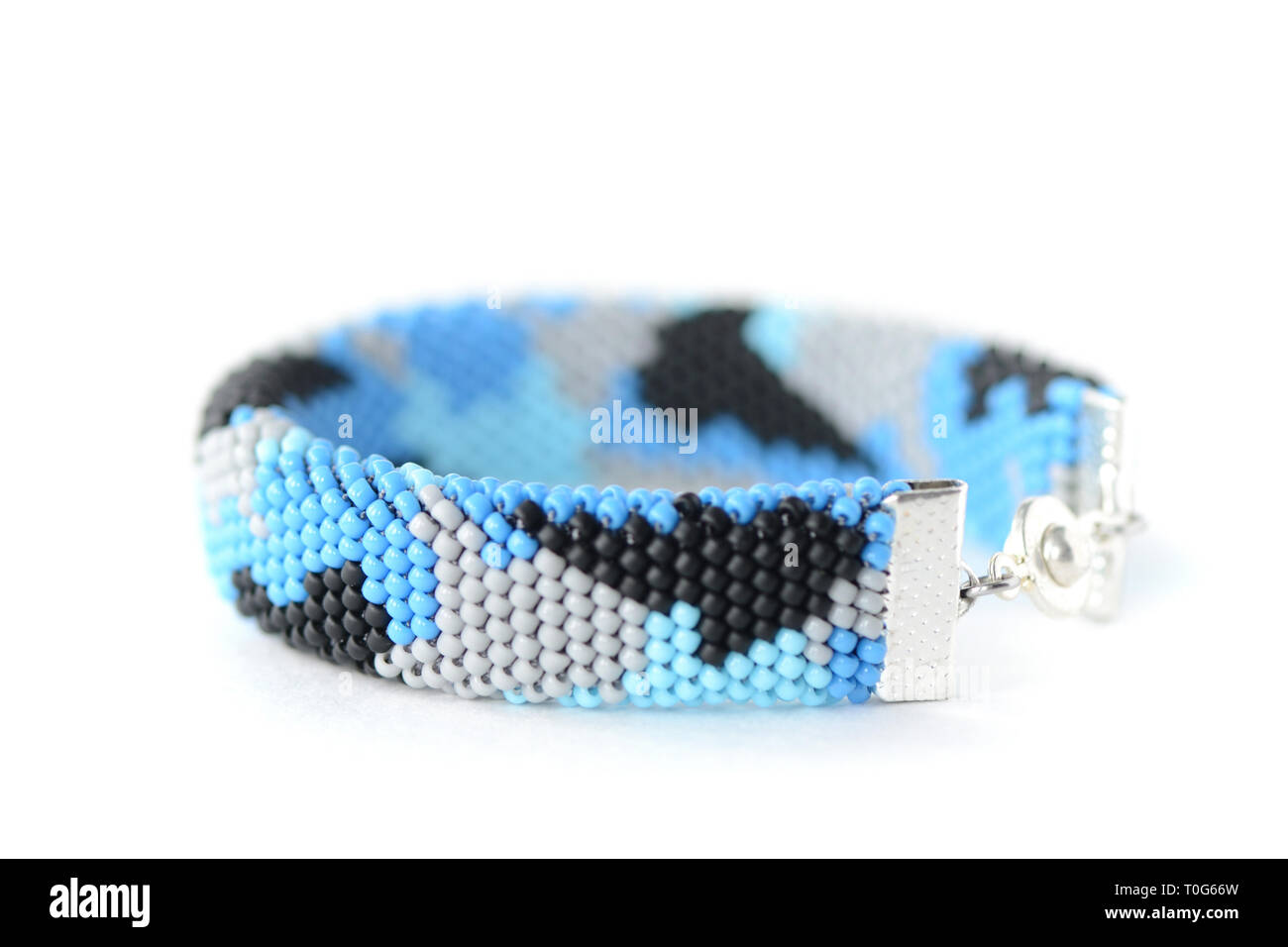 Navy blue camouflage bracelet isolated on white background close up Stock Photo